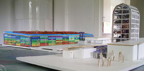 Blick zur Pferdegruppe vorne rechts, dahinter das Schulgelände.